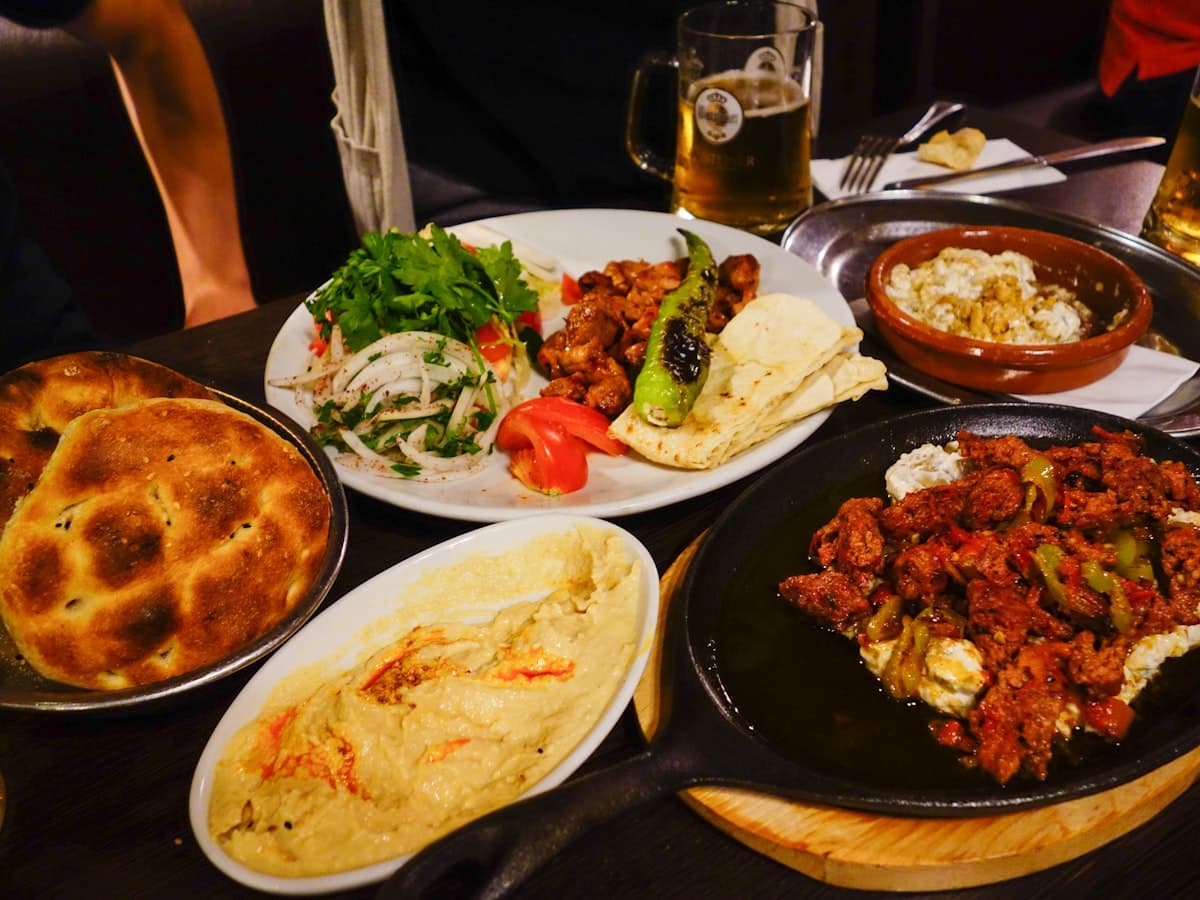 A spread of Middle Eastern mezze dishes and bread