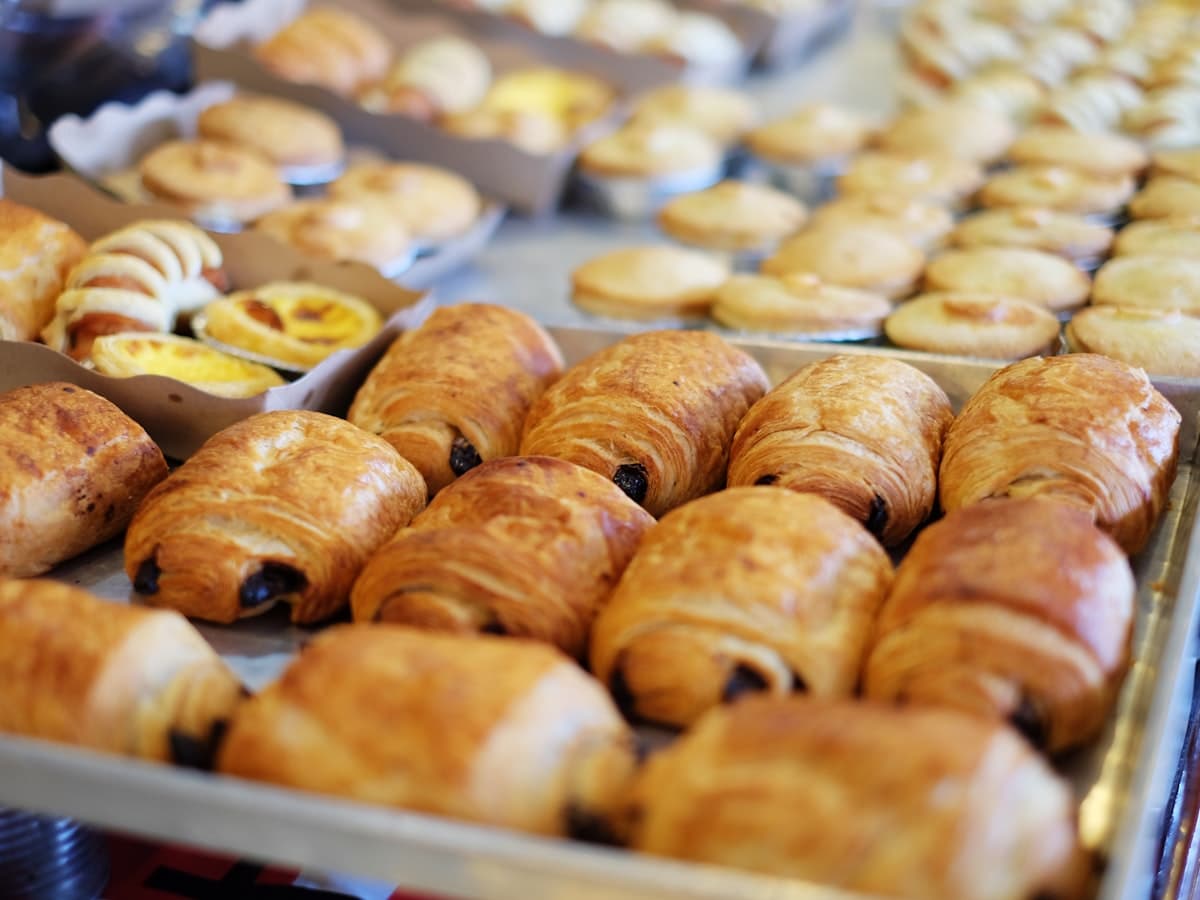 Trays of freshly baked croissants and pastries