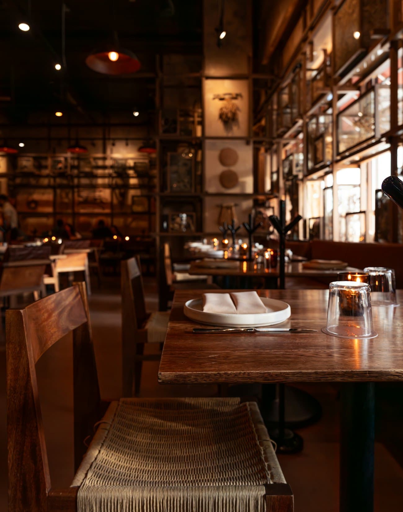 The warm interior of a restaurant in the evening